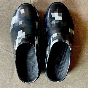 Black, white and grey Oofos clogs
